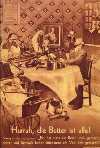 Heartfield, in collaboration with his brother Wieland Herzfelde and others, staged photographs subsequently cutting them together or superimposing negatives to create a single “scene.” (Here a pointed critique of the Hermann Göring’s suggestion that “Iron ore makes an empire strong – butter and lard have at most made it fat.” Now that their butter is gone, the nationalistic family cheerfully scarfs down a bicycle, while their baby is teething on the blade of an axe). The results of this formal manipulation look somewhat realistic at first glance, yet completely off-kilter and out of joint on closer examination – an appropriate figure for the dire circumstances Heartfield’s designs were meant to diagnose and attack.
