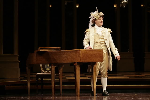 Vince Nappo as Wolfgang Amadeus Mozart appears in the unicorn mask