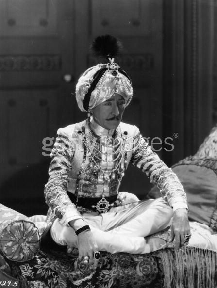 ''1937: An Indian prince sits in meditation in a scene from 'Wee Willie Winkie' about a small girl becoming the mascot of a British regiment in India. The film was adapted from a story by Rudyard Kipling and directed by John Ford for 20th Century Fox. (Photo by Hulton Archive/Getty Images)''