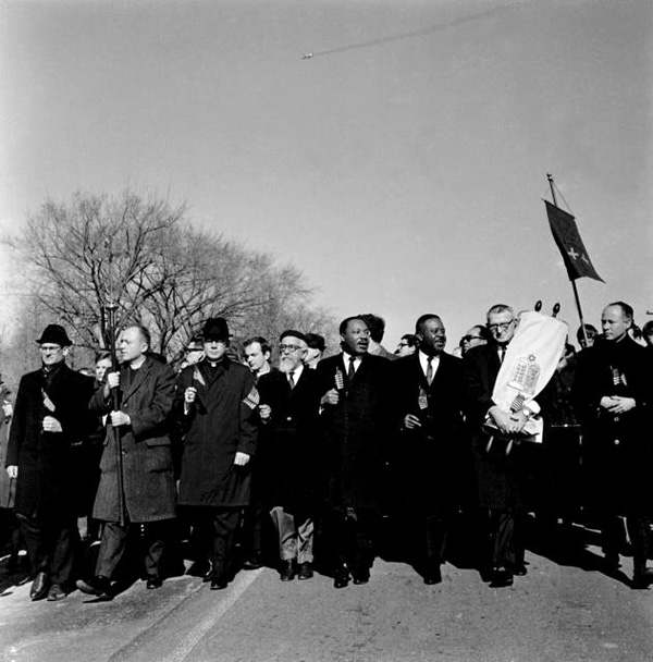 ''Arlington National Cemetery, L to R: (unknown), Episcopal Reverend Roger Alling, Roman Catholic Bishop James Shannon, (Rev. Richard Neuhaus in 2nd row), Conservative Rabbi Abraham Heschel, Martin Luther King Jr., Rev. Ralph Abernathy, Rabbi Maurice Eisendrath, Rabbi Everett Gendler  ''