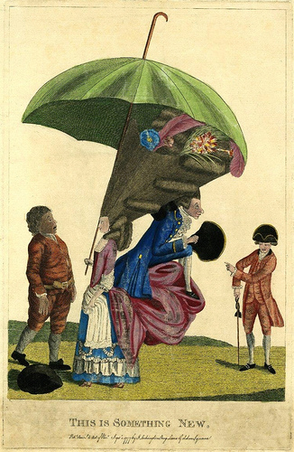 ''Published by J Lockington in 1777, this etching shows a lady with her hair in a gigantic pyramid, protected by an enormous umbrella on a very long stick. Her draped over-skirt projects at the back in mountainous folds (support known as the 'corks's rump'). On these is seated a foppishly dressed man taking shelter under the projection of her hair. A simple countryman, whose hat has fallen to the ground, gapes at the pair in amazement. A fashionably dressed man on the right leers and points at them.''