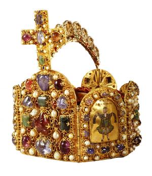 Sometimes called the Crown of Charlemagne or the Nuremberg Crown, it is an octagon of gold plates, variously enamled and encrusted with precious stones, was for centuries the supreme emblem of the sovereign who bore the title of Holy Roman Emperor. It seems to have been made at a monastery on Lake Constance for the Emperor Otto I in about 961, and possession of it later became a highly important asset for claimants to the throne. 