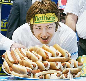 ''In more recent years, competitive eating has left the fairgrounds of America and gone global. Mr. Kobayashi, whose nickname, naturally enough, is The Tsunami, has won contests all over Japan and throughout Southeast Asia. ''