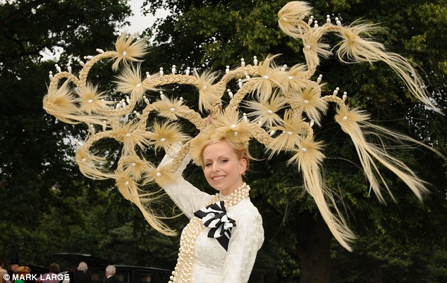 ''Hairum scarum! Racegoer Anneka Tanaka-Svenska sports an outlandish hair headpiece, created by milliner Louis Mariette, judge on the panel of Britain's Next Top Model  Read more: http://www.dailymail.co.uk/