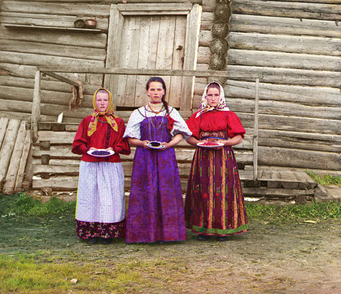 Russian Peasant Girls  Young Russian peasant women offer berries to visitors to their izba, a traditional wooden house, in a rural area along the Sheksna River near the small town of Kirillov.  Sergei Mikhailovich Prokudin-Gorskii. Peasant Girls, 1909.  Digital color rendering.  Prints and Photographs Division  (LC-DIG-ppmsc-03984) (4)