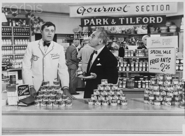 1963 --- Jerry Lewis plays store clerk Norman Phiffier and Fritz Feld plays the manager of the gourmet foods section in the 1963 movie Who's Minding the Store?. The Paramount film was directed by Frank Tashlin. ---click image for source...