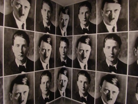 ---Rudolf Herz, Zugzwang, 1995, with the ironic juxtaposition of portraits of Marcel Duchamp and Adolf Hitler taken by same photographer. Custom-edited to fit a room at mudac, the work is exposed for only the third time---click image for source...