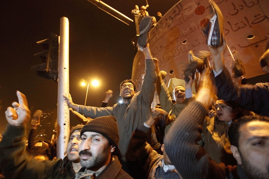 ---It was big news in 2008 when then President George W. Bush had a shoe thrown at him by an Iraqi journalist during a visit to Baghdad. In the streets of Cairo, Egyptians who are protesting Hosni Mubarak are brandishing their footwear, an insult in Arab cultures.---click image for source...