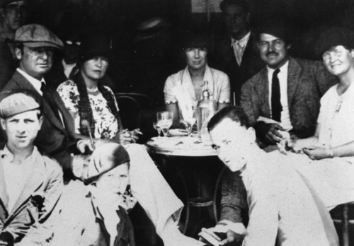 ---First of all, F. Scott sitting with Hemingway (AWESOME!!!). Hemingway and Zelda Fitzgerald, F. Scott’s wife, are sitting together even though they absolutely hated one another. But the cherry to top it all is that Hemingway is sitting in between his then-wife, Hadley, and his future second wife, Pauline. I would give anything to have been sitting at this table in Paris!!!! They truly were a “Lost Generation.”---click image for source...